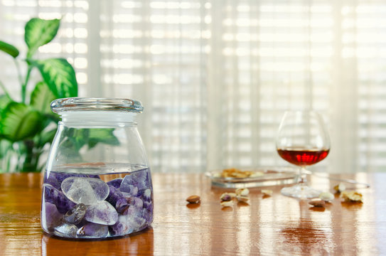Combination of two stones used in the preparation of gem elixir. Amethyst and clear quartz are placed into a glass jar filled with clean water. This homeopathic remedy helps to get over the hangover.