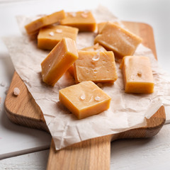 Salted caramel pieces and sea salt. Fresh caramel fudge candies