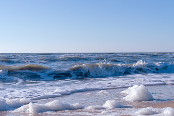 Obraz premium Image of sea foam on a sandy beach.