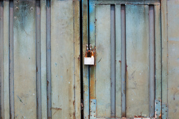 Metal rusty door with lock in grungy style