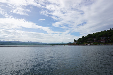 Panoramic view of the beautiful lake with blue sky at Srinakarin Dam in Kanchanaburi Province,
