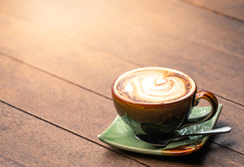 cappuccino coffee on the old wooden table