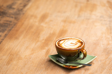 cappuccino coffee on the old wooden table