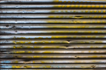 Grunge metal shutter gate. Texture of old shutter door