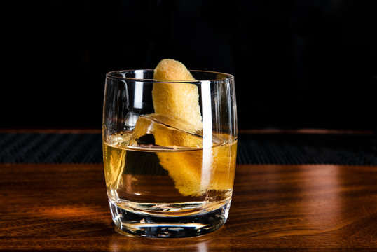 Vodka cocktail with a lemon peel garnish 