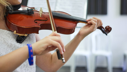 Violin classic musical instrument. Classical player hands. Details of violin playing.