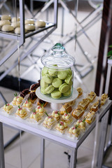 Macaroons and sweets in the glass in party decor
