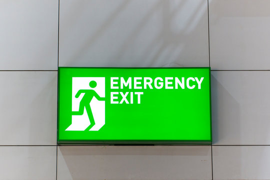 Emergency exit signs in the hotel stairs