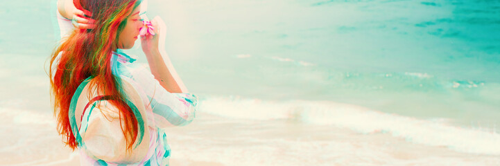 Tender young woman smell tropical frangipani flower
