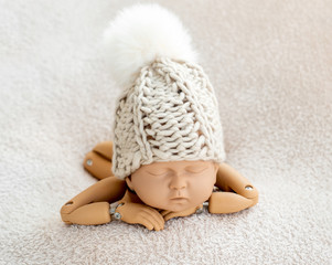 Mannequin of newborn for photo posing