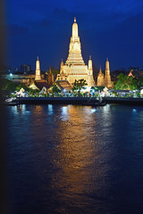 Naklejka premium Bangkok city ,Thailand - April 15, 2019:Night time view of Wat Arun (Temple) across Chao Phraya River in Bangkok, Thailand 