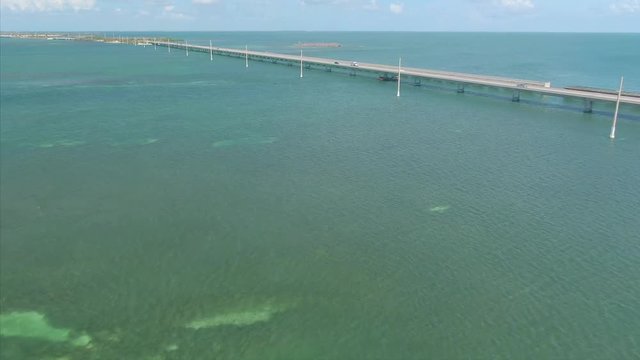 Aerial: Traffic on  seven mile bridge near Key West in the Florida Keys. Florida, USA