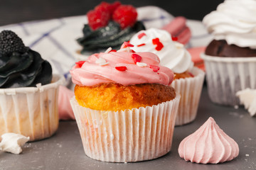 Delicious raspberry cupcakes on dark background - Handmade Sweet dessert