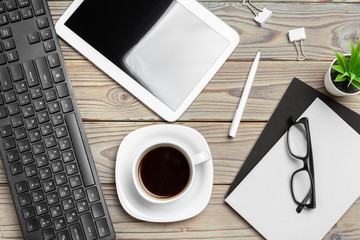 Obraz na płótnie Canvas Work space. Digital tablet and coffee cup with supplies, still life