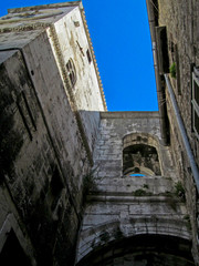 Fototapeta na wymiar Old building in the old town square of Split, Croatia. Ancient architecture of a downtown near the Diocletian’s palace is popular tourist destination. View look up.