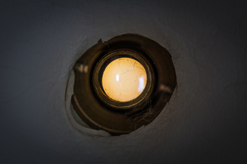 Peephole of the front door of an old apartment