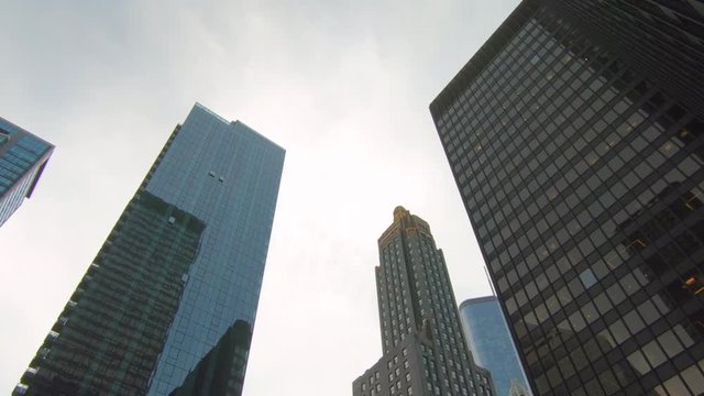 Low angle view, smooth zoom in, skyscrapers, high buildings, Chicago Illinois, United States, Usa. sky, clouds, city, cityscape, modern architecture.