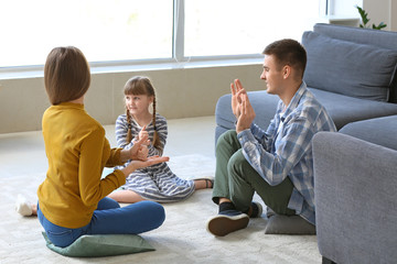 Deaf mute family using sign language at home
