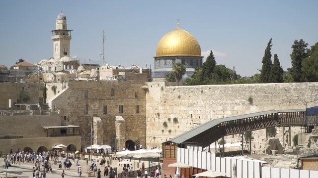 Western Wall and gold Dome of the Rock in the old city , Overview of the Western Wall JERUSALEM, ISRAEL, a sacred site of Jewish prayer