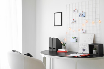 Workplace with mood board in modern room