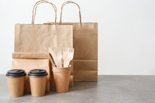 Assortment of food delivery containers on table