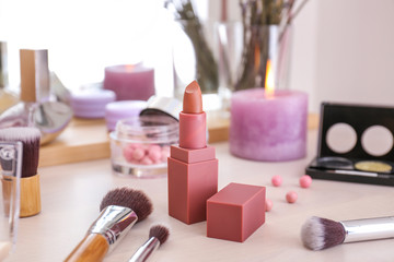 Obraz na płótnie Canvas Lipstick with brushes on dressing table
