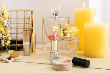 Makeup cosmetics on wooden dressing table