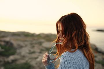 young girl blowing dandelion