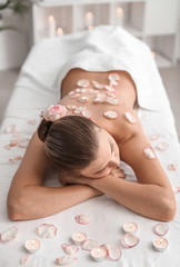 Obraz na płótnie Canvas Beautiful young woman relaxing in spa salon