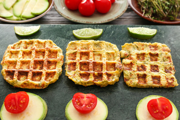 Tasty squash waffles on board, closeup