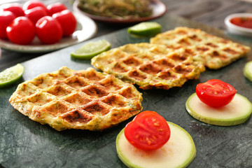 Tasty squash waffles on board, closeup