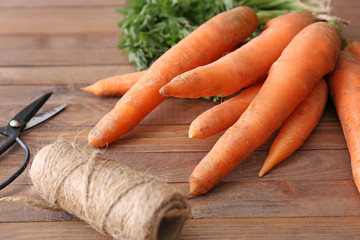 Bunch of carrots on wooden table