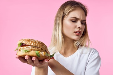 young woman with hamburger