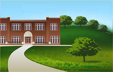 School building and empty front yard with green grass