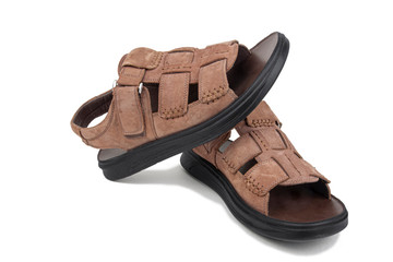 Brown leather sandals on a white background, isolate.