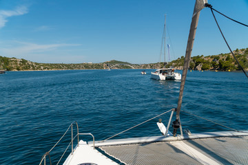 Obraz na płótnie Canvas Catamaran sailing at sea in Croatia, Europe