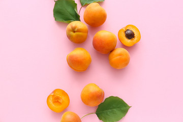 Fototapeta na wymiar Tasty apricots on color background