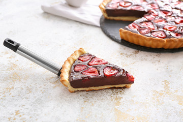 Piece of tasty chocolate strawberry cake on light background © Pixel-Shot