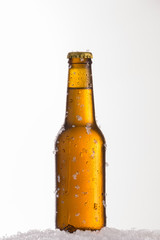 Fresh beer in cold glass amber bottle