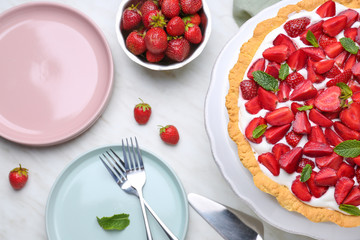 Tasty strawberry cake on light table