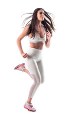 Motivated confident sporty fit woman in white tights running and looking ahead. Full body isolated on white background. 