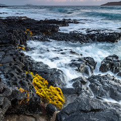 waves crashing on rocks