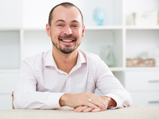 Positive young man in office