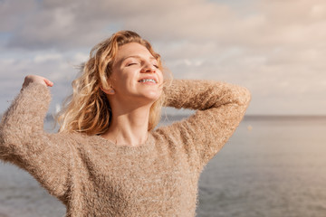 Happy woman outdoor wearing jumper