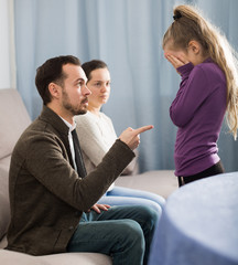Parents lecturing daughter