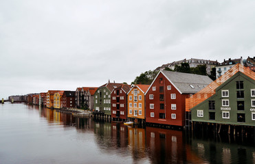 Fototapeta na wymiar Typical colored Norwegian houses on the water (or near the water)