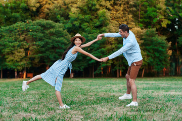 young couple running in the park