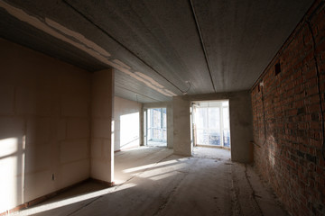 Empty large apartment after builders without repair. Start renovation. New house.