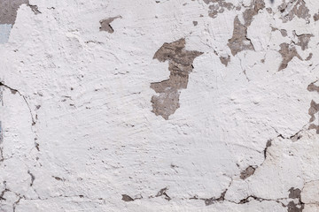 Cracked concrete texture background. Grey surface with cracks close up. Cracked grey old wall as background.