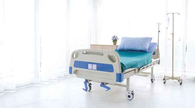 Emtry Bed On Hospital.blue And White Hospital Bed  On White Background. Patient Room  And Insurance Concept.